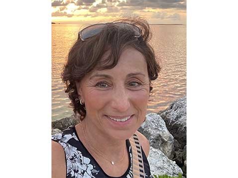 Portrait photo of a woman at the beach